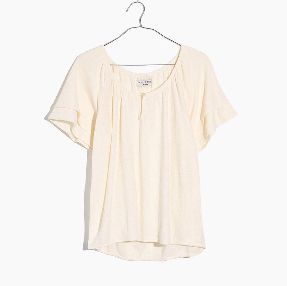 NWT cream top with slight ruffle layered sleeves